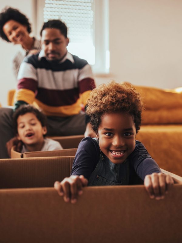 Parents and their children moving into a new house