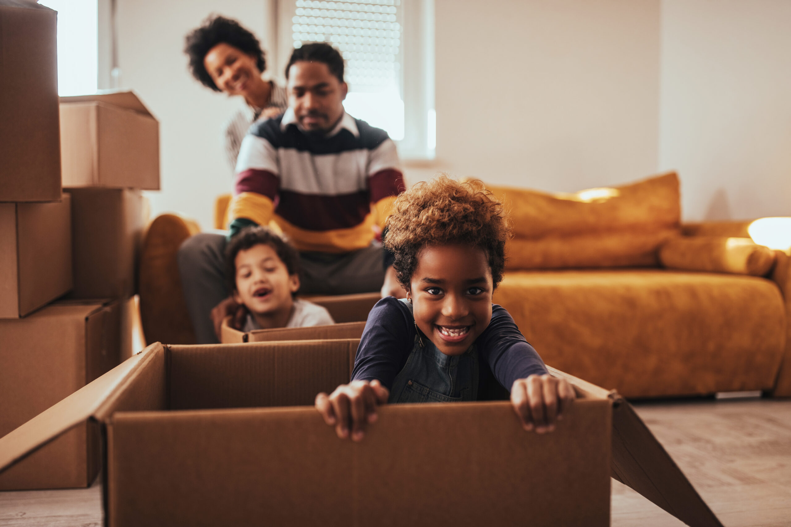 Parents and their children moving into a new house